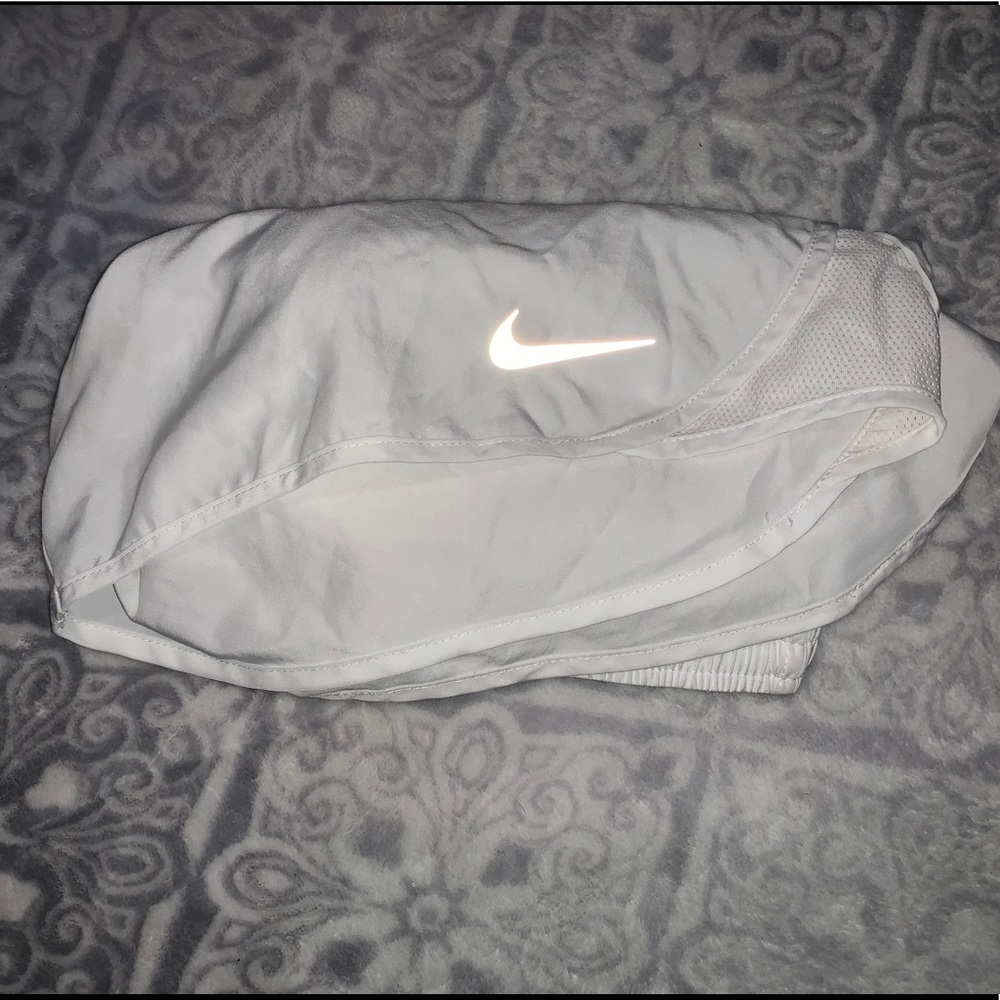 White Nike running shorts